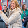 Reiziger staat in HTM tram Reiziger staat in HTM tram en lacht naar de camera